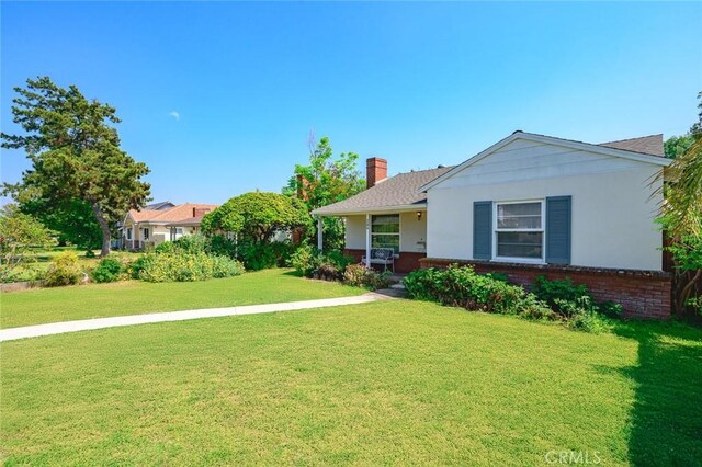 204 E Floral Ave, Arcadia, CA 91006 - single story home featuring a front yard, a chimney, and brick siding
