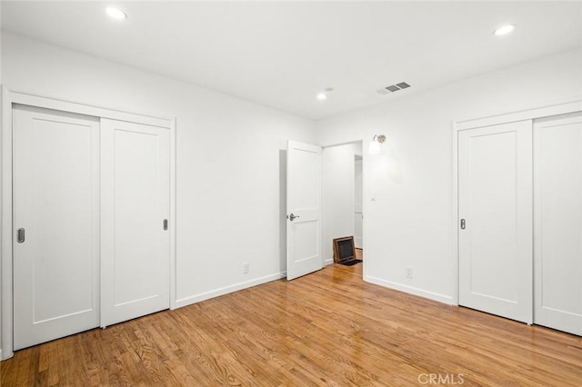 204 E Floral Ave, Arcadia, CA 91006 - unfurnished bedroom with two closets, light wood-type flooring, recessed lighting, and baseboards