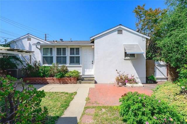 204 E Floral Ave, Arcadia, CA 91006 - view of front facade with central AC unit, fence, a gate, stucco siding, and a patio area