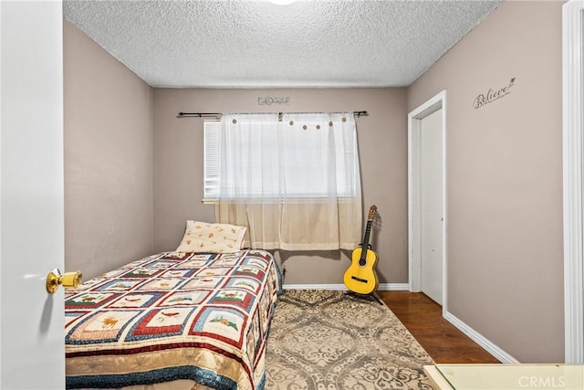 1572 Fremont Ave, Simi Valley, CA 93065 - bedroom featuring wood finished floors, a textured ceiling, and baseboards