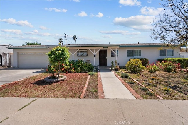 1572 Fremont Ave, Simi Valley, CA 93065 - ranch-style house with stucco siding, concrete driveway, and an attached garage