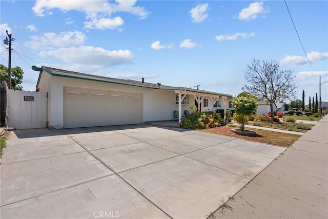 1572 Fremont Ave, Simi Valley, CA 93065 - ranch-style house featuring stucco siding, driveway, and a garage
