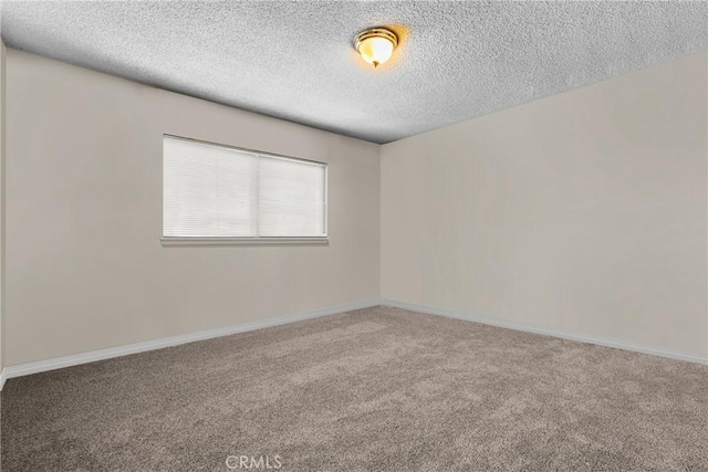 1572 Fremont Ave, Simi Valley, CA 93065 - carpeted spare room with a textured ceiling and baseboards