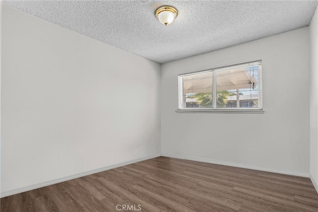1572 Fremont Ave, Simi Valley, CA 93065 - spare room with wood finished floors, baseboards, and a textured ceiling