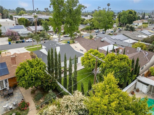 birds eye view of property with a residential view