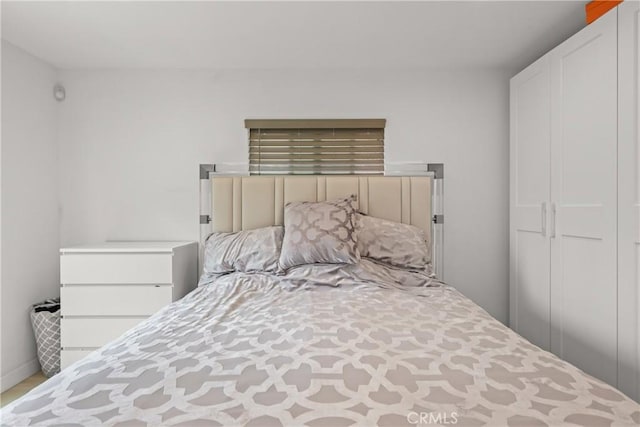 bedroom featuring baseboards