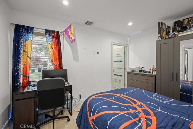 bedroom with visible vents and recessed lighting