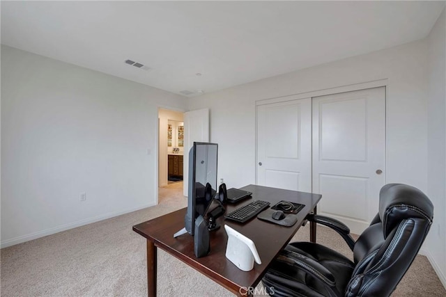 home office featuring carpet, baseboards, and visible vents