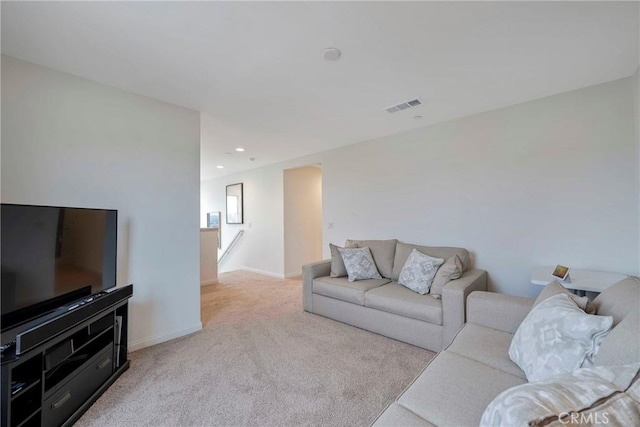 carpeted living room featuring baseboards, recessed lighting, and visible vents