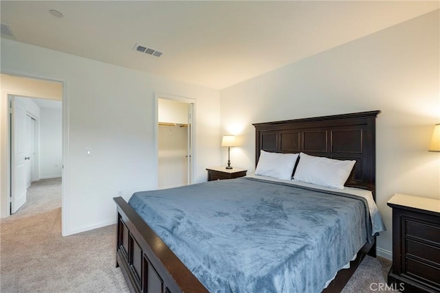 bedroom featuring light colored carpet, visible vents, and baseboards