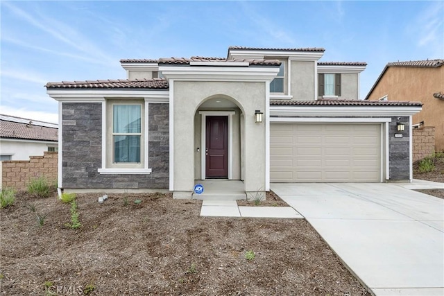 view of front of home featuring driveway, fence, an attached garage, stucco siding, and a tile roof