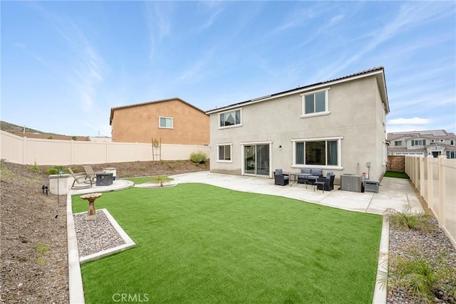 back of property with a yard, a fenced backyard, a patio, and central AC unit