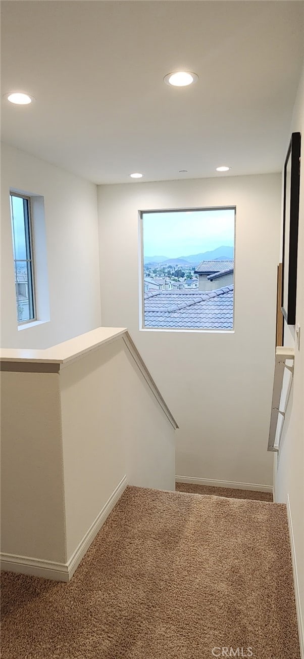 stairs with carpet flooring, recessed lighting, and baseboards