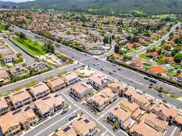 drone / aerial view with a residential view and a mountain view