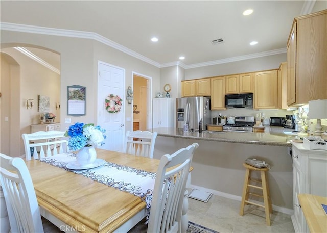 1643 Landmark Way, Beaumont, CA 92223 - dining space featuring ornamental molding, visible vents, arched walkways, and recessed lighting