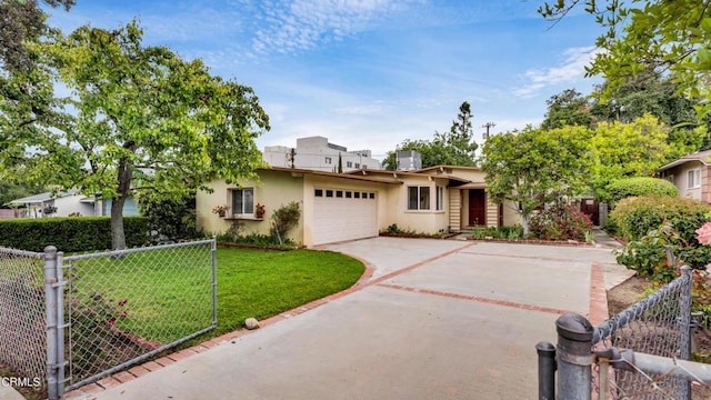 10424 Mcvine Ave, Sunland, CA 91040 - view of front of home with stucco siding, an attached garage, and concrete driveway