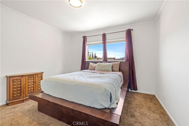 bedroom featuring baseboards, carpet flooring, and crown molding