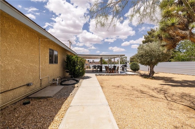 view of yard with a patio area and fence