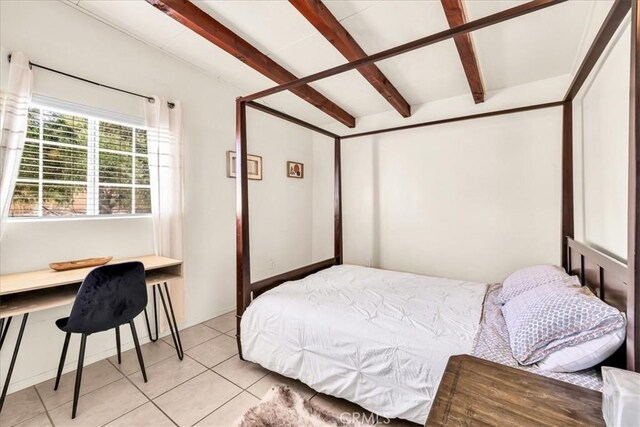 74825 Alta Loma Dr Unit 29, Palms, CA 92277 - bedroom with light tile patterned floors and beamed ceiling