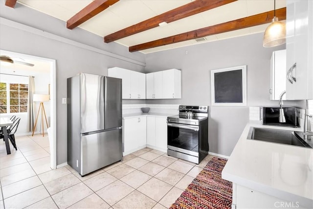 74825 Alta Loma Dr Unit 29, Palms, CA 92277 - kitchen with appliances with stainless steel finishes, light countertops, a sink, light tile patterned floors, and beam ceiling