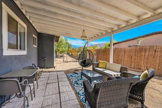 74825 Alta Loma Dr Unit 29, Palms, CA 92277 - view of patio featuring a fenced backyard and an outdoor living space