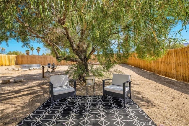 74825 Alta Loma Dr Unit 29, Palms, CA 92277 - view of patio with a fenced backyard