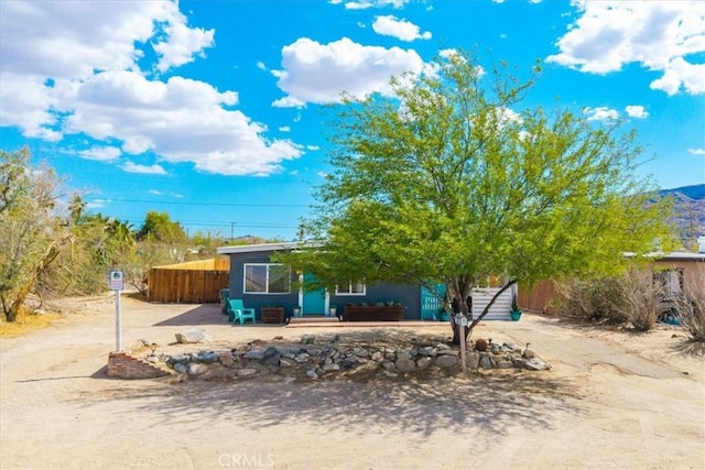 74825 Alta Loma Dr Unit 29, Palms, CA 92277 - obstructed view of property featuring fence