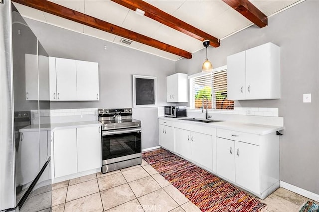 74825 Alta Loma Dr Unit 29, Palms, CA 92277 - kitchen with stainless steel electric range, beam ceiling, a sink, light countertops, and white cabinets