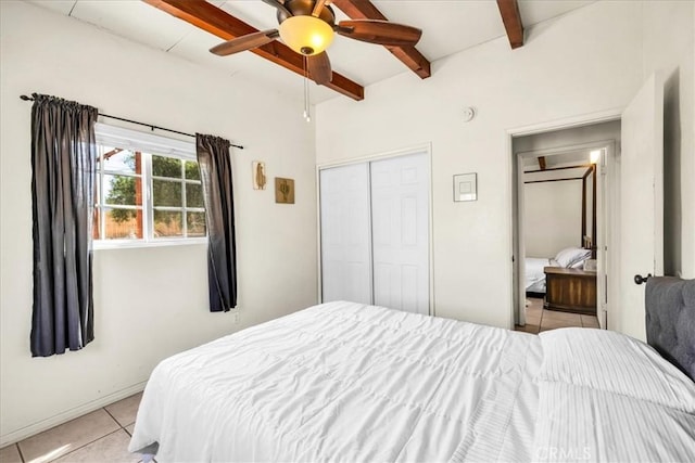 74825 Alta Loma Dr Unit 29, Palms, CA 92277 - bedroom with light tile patterned floors, beamed ceiling, a closet, and ceiling fan