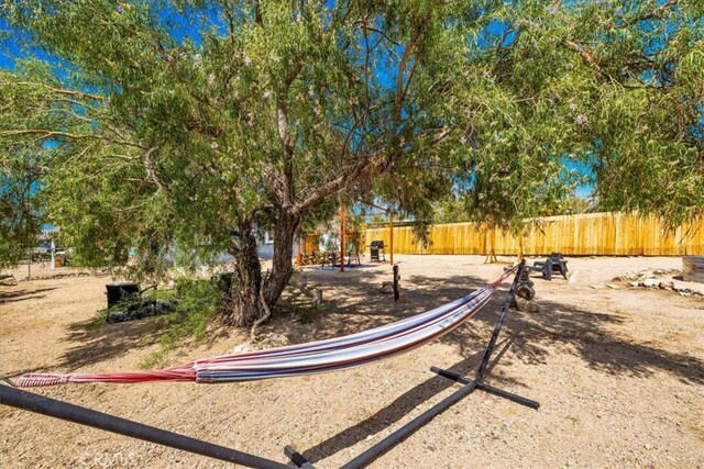 74825 Alta Loma Dr Unit 29, Palms, CA 92277 - view of property's community featuring fence