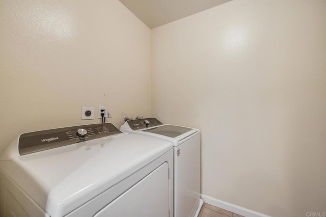 552 Canyon Dr Unit 15, Oceanside, CA 92054 - clothes washing area with washing machine and dryer, baseboards, and light tile patterned flooring