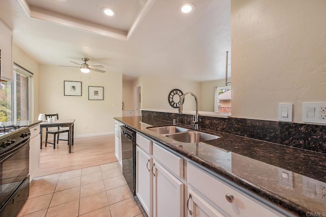 552 Canyon Dr Unit 15, Oceanside, CA 92054 - kitchen featuring a sink, black appliances, dark stone countertops, white cabinets, and a tray ceiling