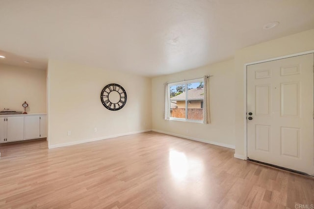 552 Canyon Dr Unit 15, Oceanside, CA 92054 - unfurnished living room with light wood finished floors, baseboards, and recessed lighting