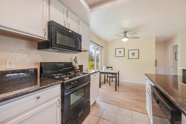 552 Canyon Dr Unit 15, Oceanside, CA 92054 - kitchen featuring black appliances, white cabinetry, ceiling fan, and light tile patterned flooring