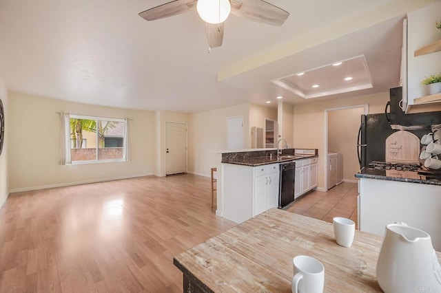 552 Canyon Dr Unit 15, Oceanside, CA 92054 - kitchen featuring black appliances, white cabinetry, a sink, baseboards, and ceiling fan