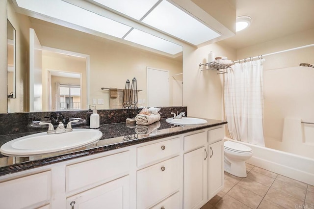 552 Canyon Dr Unit 15, Oceanside, CA 92054 - full bath with tile patterned flooring, shower / bath combo with shower curtain, toilet, and double vanity