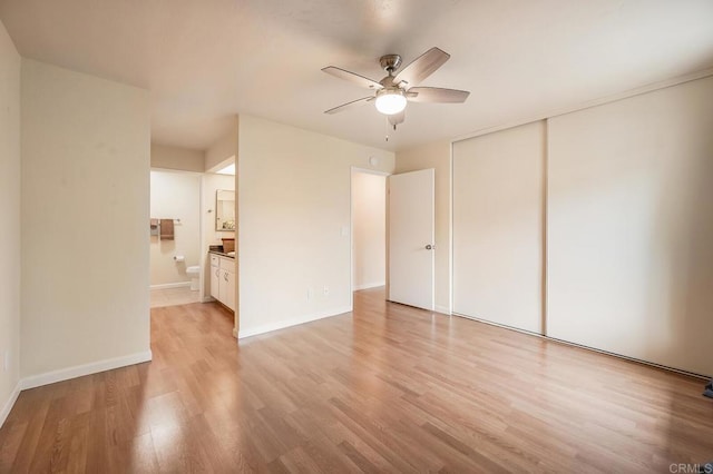 552 Canyon Dr Unit 15, Oceanside, CA 92054 - unfurnished bedroom with a closet, light wood-type flooring, baseboards, ensuite bathroom, and ceiling fan