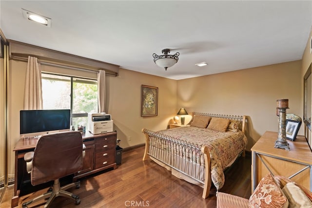 9905 Pangborn Ave, Downey, CA 90240 - bedroom with dark wood-type flooring and baseboards