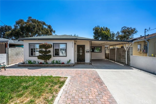 22702 Menlo Ave, Torrance, CA 90502 - view of front of property with concrete driveway, stucco siding, fence, and a carport