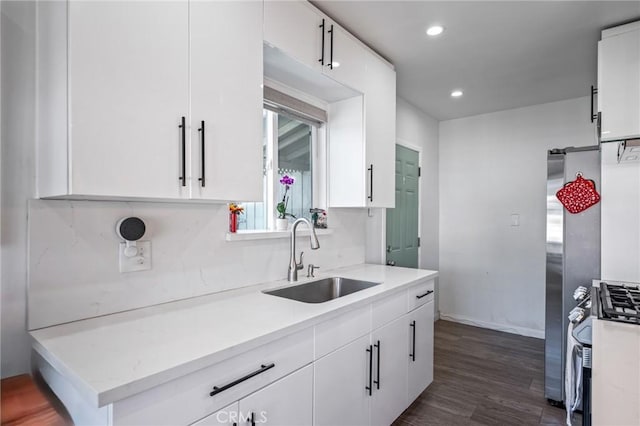 22702 Menlo Ave, Torrance, CA 90502 - kitchen featuring a sink, white cabinets, gas range, dark wood-type flooring, and recessed lighting