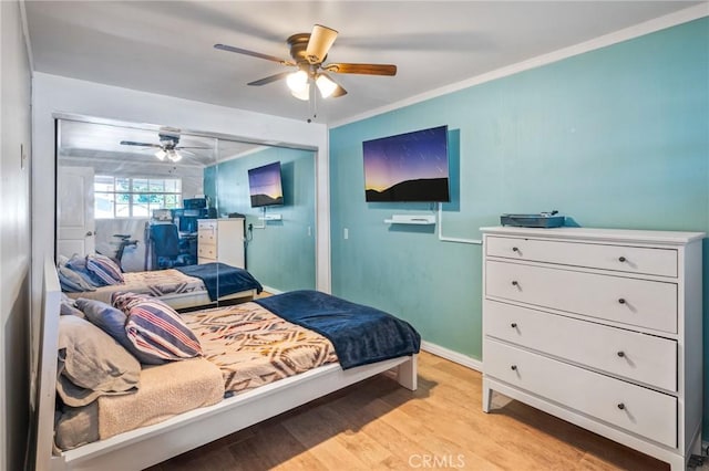 22702 Menlo Ave, Torrance, CA 90502 - bedroom with light wood-type flooring, baseboards, a ceiling fan, ornamental molding, and a closet