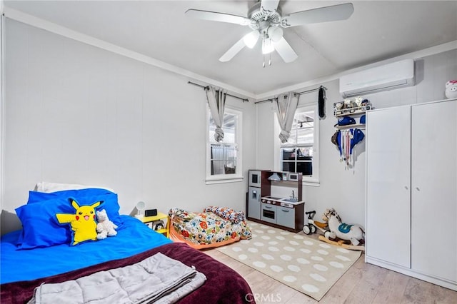22702 Menlo Ave, Torrance, CA 90502 - bedroom with a wall mounted AC, light wood-style floors, and ceiling fan