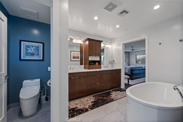 full bath with a soaking tub, visible vents, a sink, and double vanity