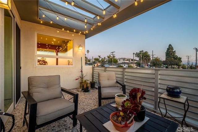 balcony featuring a pergola