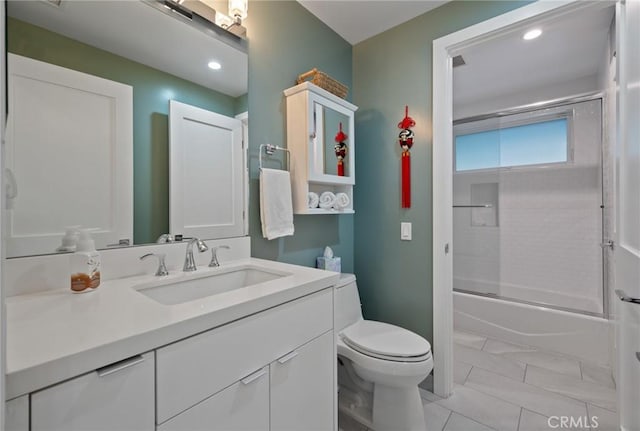 bathroom with recessed lighting, toilet, marble finish floor, vanity, and combined bath / shower with glass door