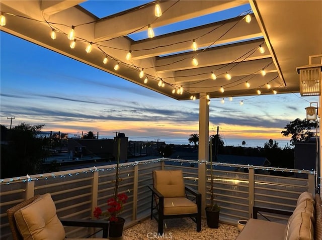 view of patio featuring a balcony