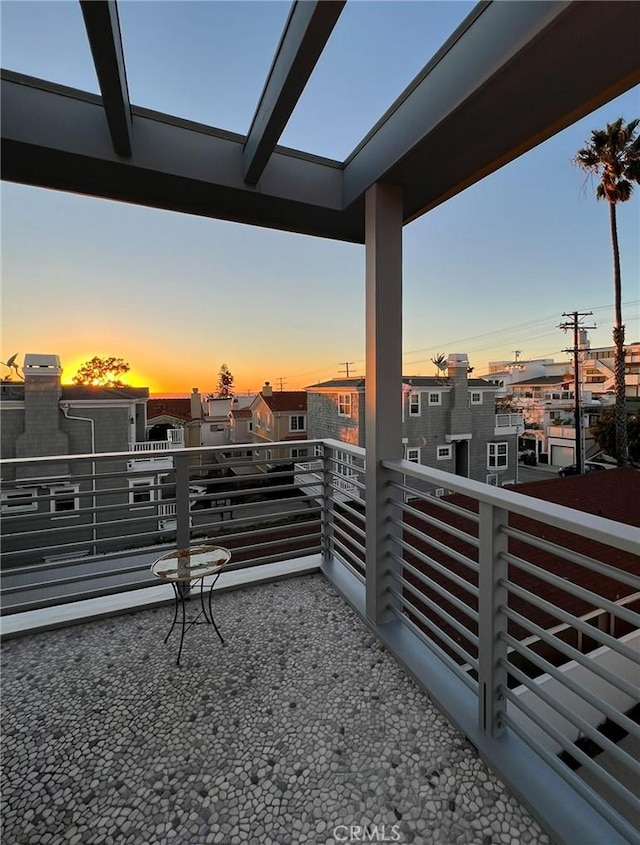 view of patio featuring a residential view and a balcony