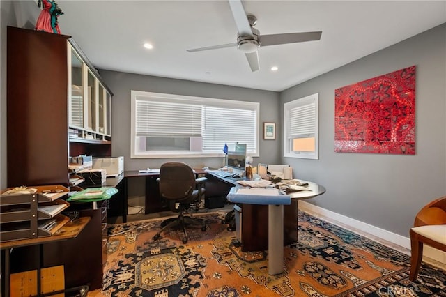 office space featuring a ceiling fan, baseboards, and recessed lighting