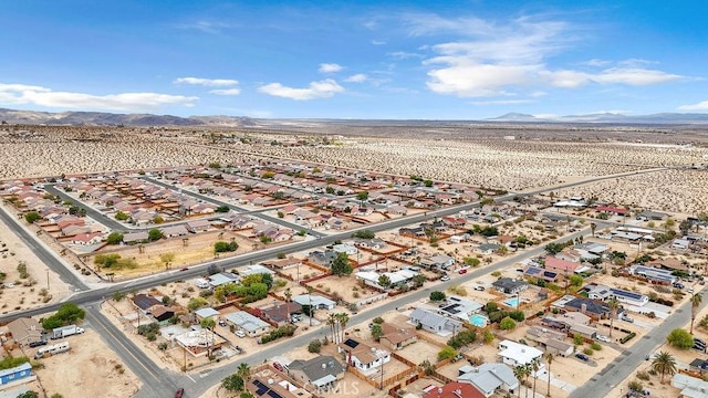 birds eye view of property featuring a mountain view and a residential view