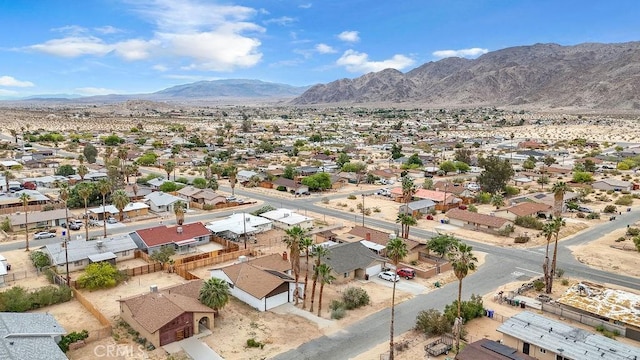 drone / aerial view featuring a residential view and a mountain view